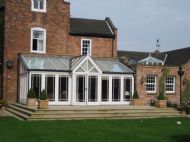 Conservatory replacing existing and new stone terrace to a Listed Building
